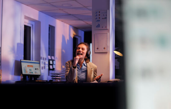 executive-manager-with-headphones-listening-music-having-fun